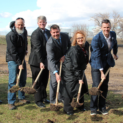 Forward Sioux Falls Investors shoveling dirt to start the project