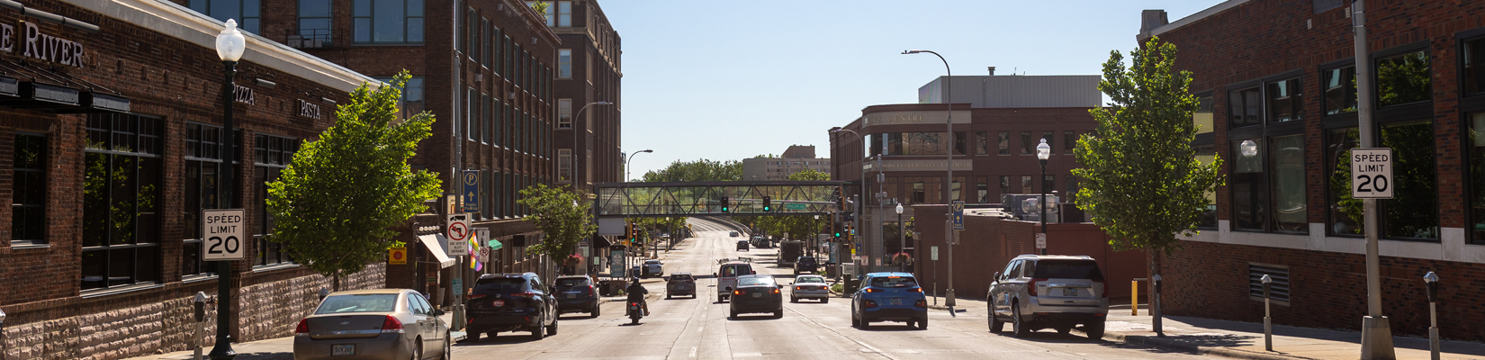A photo of vehicles driving down a street in Downtown Sioux Falls SD